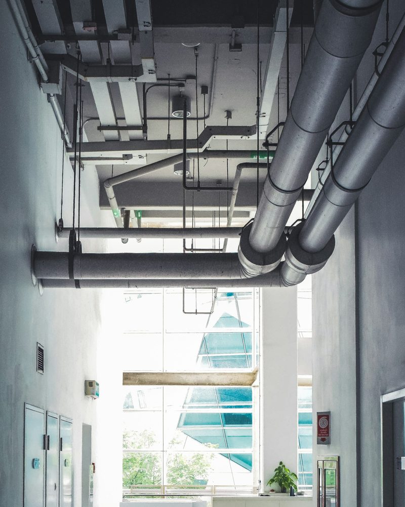 Exposed ducts and pipework in a commercial building