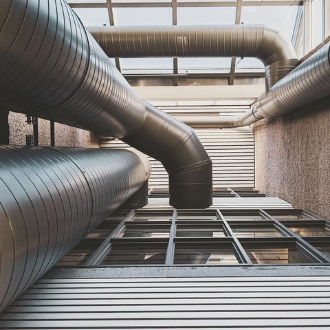 Large spiral ventilation ducts in a commercial building